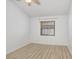 Bedroom featuring a window with natural light, neutral paint and flooring at 1017 Cameo Crest Ln, Valrico, FL 33596
