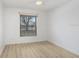Bedroom featuring a window with view and neutral walls and flooring at 1017 Cameo Crest Ln, Valrico, FL 33596