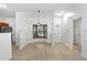 Bright dining area featuring new flooring, natural light, and close proximity to kitchen at 1017 Cameo Crest Ln, Valrico, FL 33596