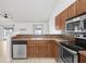 Well-equipped kitchen with stainless steel appliances and an open view of the living area at 1017 Cameo Crest Ln, Valrico, FL 33596