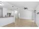 Bright open living space with new floors, ceiling fan, and view of the dining area at 1017 Cameo Crest Ln, Valrico, FL 33596