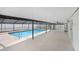Inviting covered pool area with an in-ground pool and surrounding patio at 1017 Cameo Crest Ln, Valrico, FL 33596