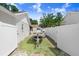 Spacious side yard features a boat and white fence offering privacy and storage solutions at 1017 Cameo Crest Ln, Valrico, FL 33596