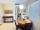 Charming dining area features a round table with four chairs, perfect for enjoying meals at 102 Cambridge Trl # 230, Sun City Center, FL 33573