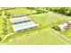 Aerial view of lawn bowling facilities featuring multiple rinks and seating at 102 Cambridge Trl # 230, Sun City Center, FL 33573