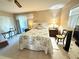 Inviting main bedroom with natural light and a comfortable bed at 102 Cambridge Trl # 230, Sun City Center, FL 33573