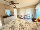 Serene main bedroom featuring a cozy bed, closet, and an en suite bathroom at 102 Cambridge Trl # 230, Sun City Center, FL 33573