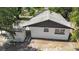 An aerial view showcasing the rear of the home and back yard with mature trees at 1119 Eau Claire Cir, Tampa, FL 33619