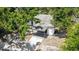 A high-angle aerial view of the home with covered carport and driveway at 1119 Eau Claire Cir, Tampa, FL 33619