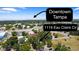 Aerial view showcasing the property's location with a view of Downtown Tampa in the distance at 1119 Eau Claire Cir, Tampa, FL 33619