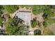An aerial view of a home showing the roof and mature trees at 1119 Eau Claire Cir, Tampa, FL 33619