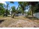 Spacious backyard offers privacy and outdoor enjoyment with mature trees at 1119 Eau Claire Cir, Tampa, FL 33619