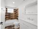 Well-lit bathroom with modern fixtures and unique tiling at 1119 Eau Claire Cir, Tampa, FL 33619