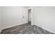 Bright bedroom features modern gray floors, white walls and trim, and closet at 1119 Eau Claire Cir, Tampa, FL 33619