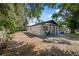 A charming home with covered porch and backyard view with mature trees at 1119 Eau Claire Cir, Tampa, FL 33619