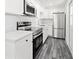 Modern kitchen with stainless steel appliances and ample counter space at 1119 Eau Claire Cir, Tampa, FL 33619
