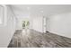 Spacious and bright living room featuring gray floors, white walls, and access to the outdoor patio at 1119 Eau Claire Cir, Tampa, FL 33619