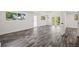 Open living area featuring multiple doors and large windows at 1119 Eau Claire Cir, Tampa, FL 33619