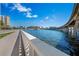 Waterfront with bridge, river, and sidewalk showcasing the city's beautiful waterfront amenities at 1119 Eau Claire Cir, Tampa, FL 33619