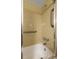 Bright bathroom features grab bars, updated fixtures, and a clean, white bathtub at 11485 Oakhurst Rd # 200-101, Largo, FL 33774