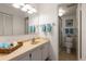 Bright bathroom featuring neutral paint, tile flooring, and modern fixtures at 11485 Oakhurst Rd # 200-101, Largo, FL 33774