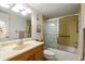 Bathroom featuring neutral paint, tile flooring, and a shower/bath combo at 11485 Oakhurst Rd # 200-101, Largo, FL 33774