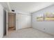 Bright bedroom features neutral carpet, paint, and a large closet at 11485 Oakhurst Rd # 200-101, Largo, FL 33774