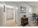 Hallway that leads to the living room showcases tile flooring, fresh paint, and ample storage at 11485 Oakhurst Rd # 200-101, Largo, FL 33774