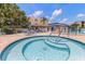 Community hot tub with pool nearby and plenty of lounge seating at 11485 Oakhurst Rd # 200-101, Largo, FL 33774