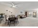 Spacious living room features neutral carpeting, ceiling fan, and ample natural light at 11485 Oakhurst Rd # 200-101, Largo, FL 33774