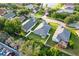 High angle aerial showcasing the home's backyard, neighborhood, and nearby pond at 11845 Autumn Creek Dr, Riverview, FL 33569