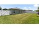 View of a well-maintained and spacious back yard featuring a solid white fence for privacy at 11845 Autumn Creek Dr, Riverview, FL 33569