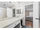 Bathroom showcases a vanity, mirror with lighting, and doorway view into a bedroom at 11845 Autumn Creek Dr, Riverview, FL 33569