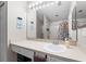 Bathroom featuring a vanity, large mirror, and shower-tub combo with decorative curtain at 11845 Autumn Creek Dr, Riverview, FL 33569