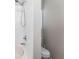 Clean bathroom with a white tub, shower, toilet, and neutral wall paint at 11845 Autumn Creek Dr, Riverview, FL 33569