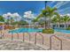 A resort-style pool area with ample seating and lush landscaping creating an oasis at 11845 Autumn Creek Dr, Riverview, FL 33569