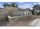 Stone textured community welcome fountain and paved entryway for a welcoming entrance at 11845 Autumn Creek Dr, Riverview, FL 33569