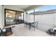 Covered patio featuring a dining area and grill, ideal for outdoor gatherings at 11845 Autumn Creek Dr, Riverview, FL 33569