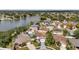 This aerial view of the property showcases the lake and surrounding neighborhood at 1204 Rinkfield Pl, Brandon, FL 33511