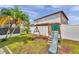 This backyard features a swing set, slide, and a white privacy fence at 1204 Rinkfield Pl, Brandon, FL 33511
