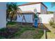 Large backyard featuring a playground and white vinyl fence, perfect for outdoor fun at 1204 Rinkfield Pl, Brandon, FL 33511
