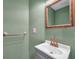 Cozy powder room with updated vanity, mirror and hardware at 1204 Rinkfield Pl, Brandon, FL 33511