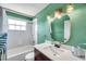 Bathroom with a white sink, shower, and toilet at 1204 Rinkfield Pl, Brandon, FL 33511