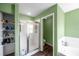 Bathroom featuring a shower and a separate toilet area at 1204 Rinkfield Pl, Brandon, FL 33511