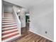 The foyer features wood laminate flooring, a staircase and gives an open feel to the interior at 1204 Rinkfield Pl, Brandon, FL 33511