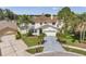 Charming two-story home with a well-maintained lawn, lush landscaping, and a spacious driveway at 1204 Rinkfield Pl, Brandon, FL 33511