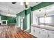 Open concept kitchen with granite countertops and stainless steel refrigerator at 1204 Rinkfield Pl, Brandon, FL 33511
