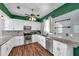 Modern kitchen with stainless steel appliances, granite countertops, and grey subway tile backsplash at 1204 Rinkfield Pl, Brandon, FL 33511