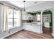 Bright eat-in kitchen featuring granite counters, white cabinets, and a window over the sink at 1204 Rinkfield Pl, Brandon, FL 33511
