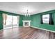 Inviting living room with fireplace, hardwood floors, and lots of natural light at 1204 Rinkfield Pl, Brandon, FL 33511